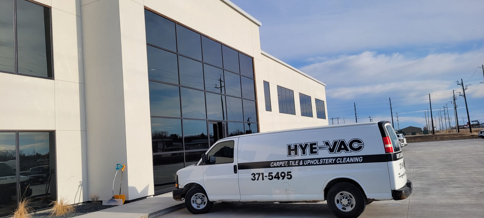 Hye-Vac Carpet Cleaning Van Outside Commercial Building Hye-Vac cleaning company van on-site at a commercial property in Manitoba.